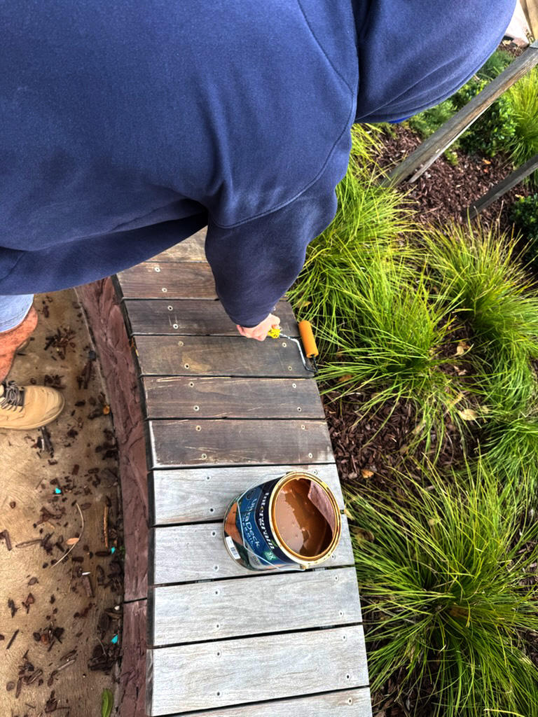 Staining timber